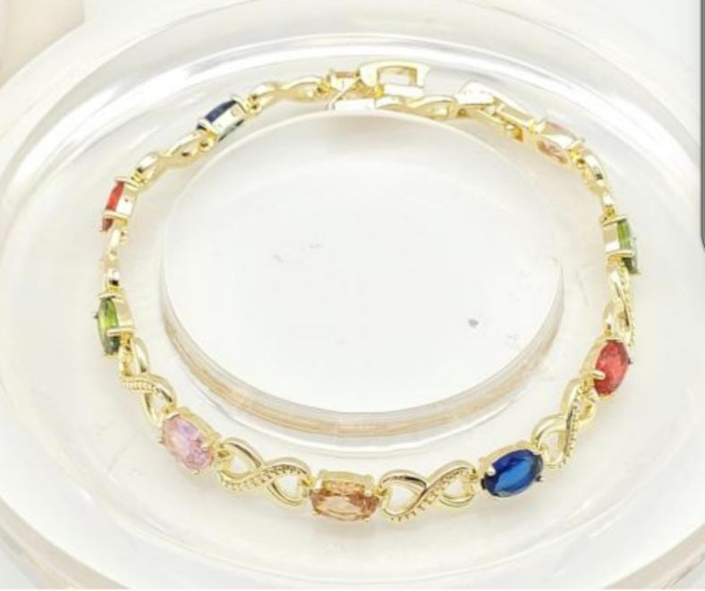 Bracelet Plaqué Or 18 carats orné de pierres en couleurs.